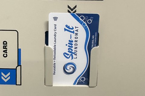 Spin-It card placed in the kiosk card holder to reload