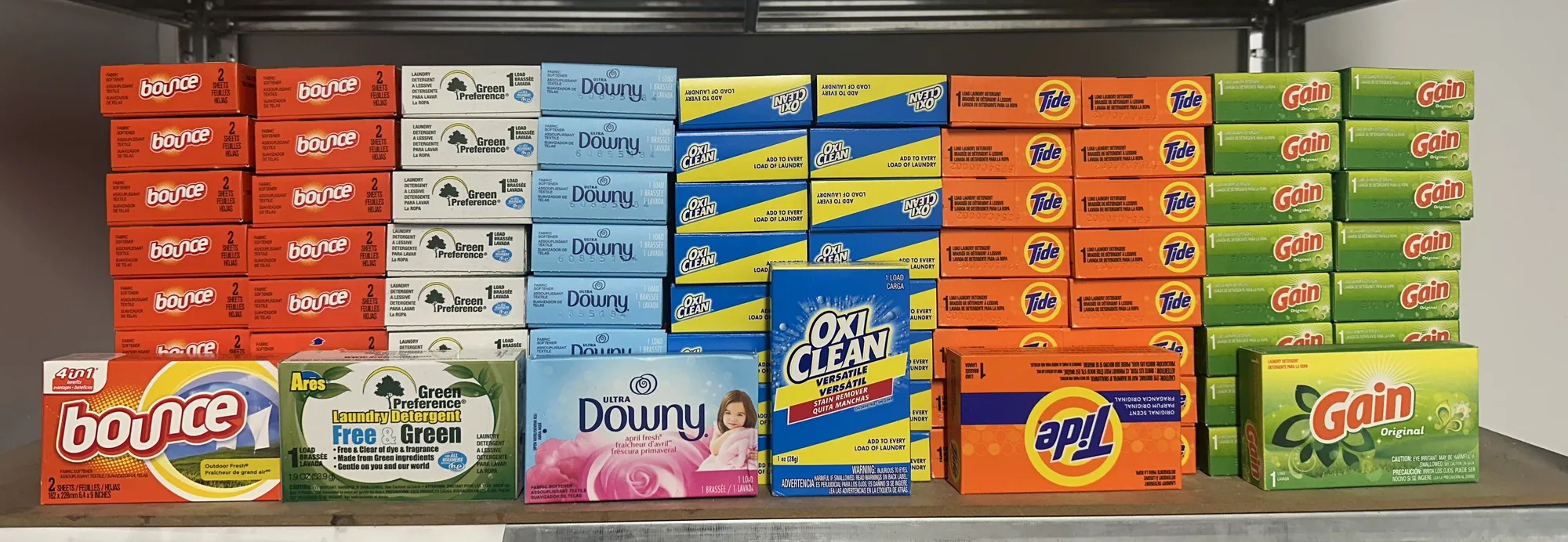 Laundry products for sale at Spin-It Laundromat — Tide, Gain, Bounce, Downy, OxiClean and more